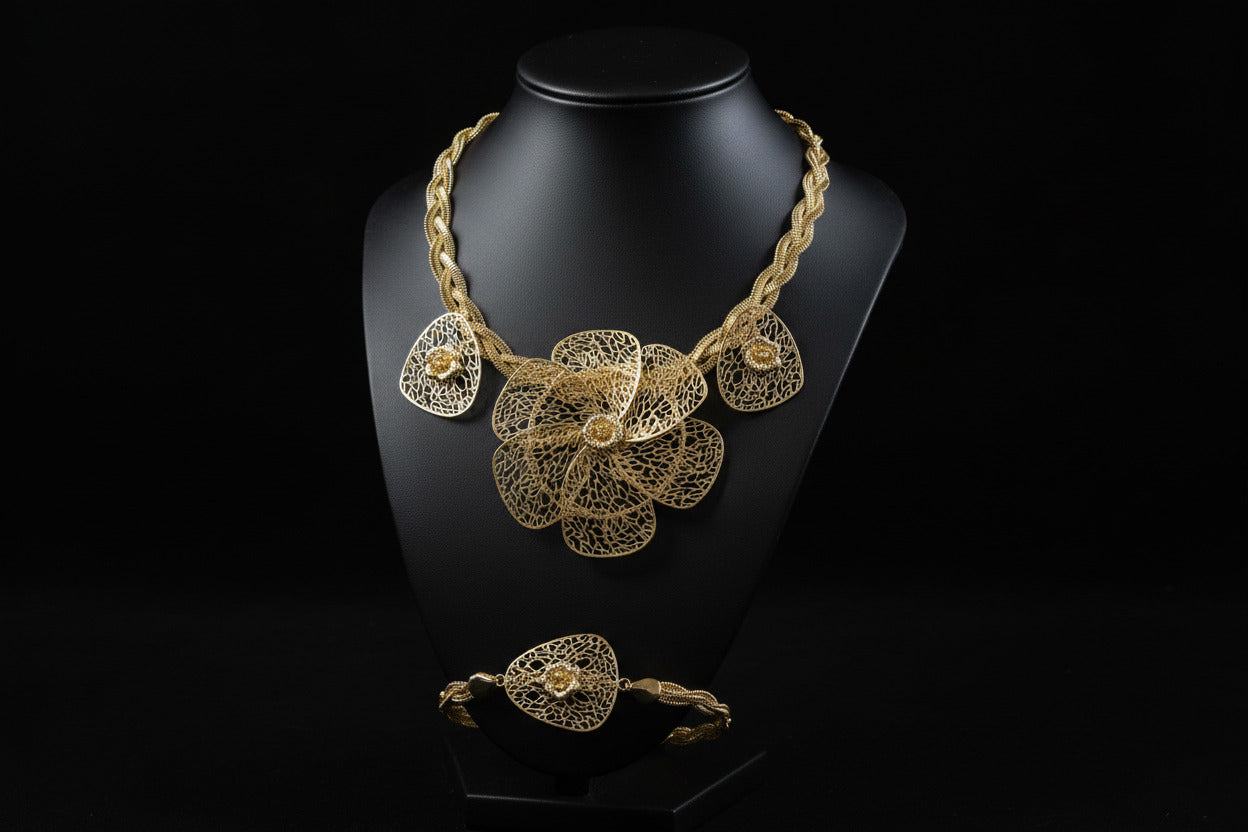 Bentix Brazilian Gold floral plaited jewelry set featuring gold and silver plated necklaces, bangles, rings, and earrings